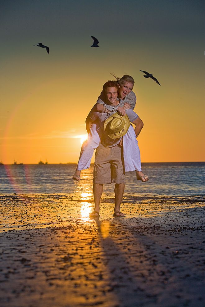 Couple lit by wireless battery powered studio flash on a tall pole manouvered by Tim's wife Emma in this fast moving beach shoot. /// Click for previous page.